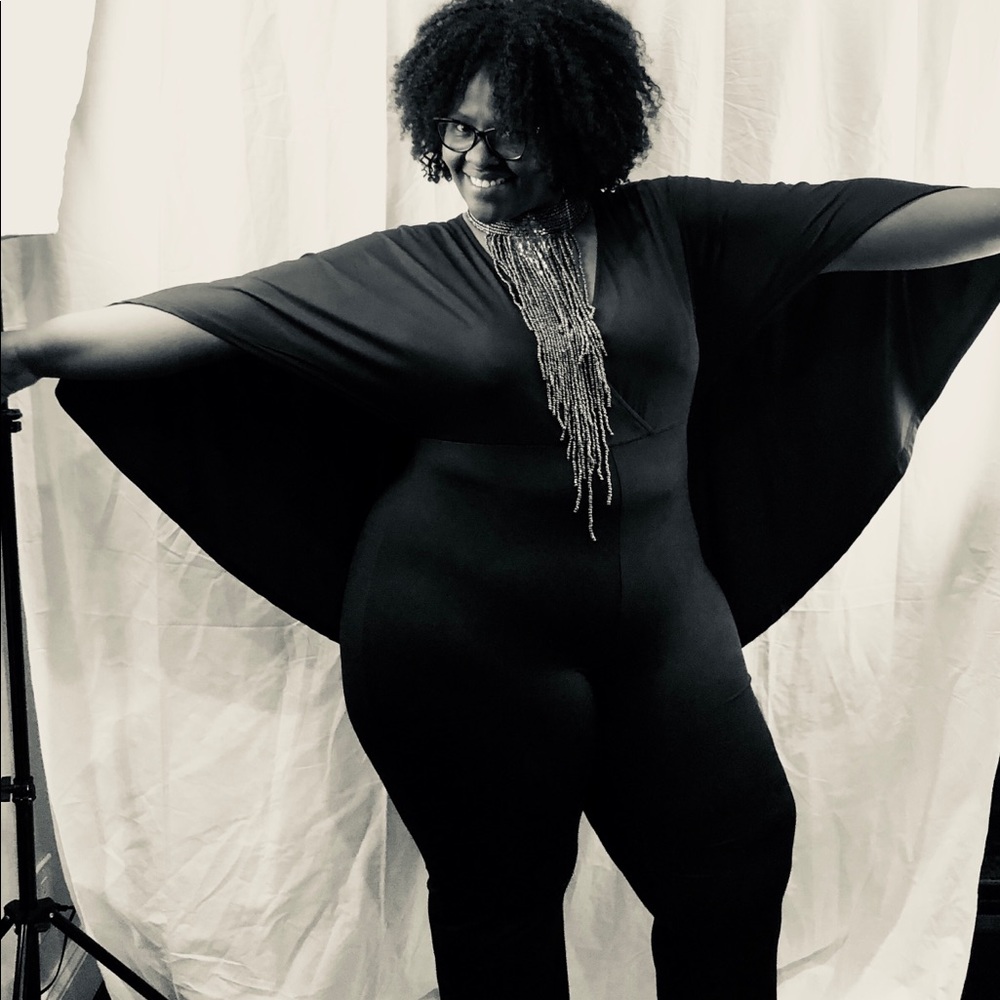 Brand new jumper with attached cape